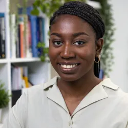 Black woman wearing white top