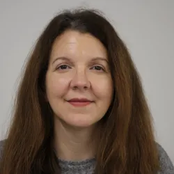 Smiling white woman with brown hair