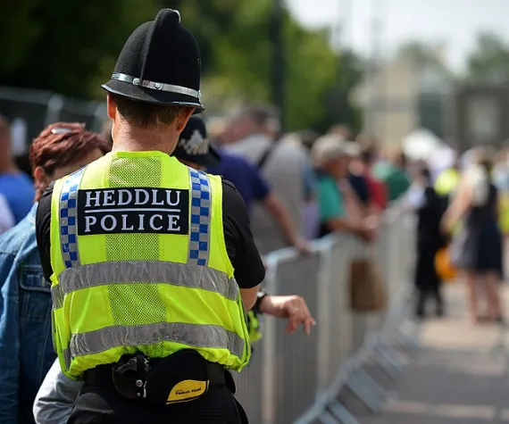 Welsh policeman talking to the public