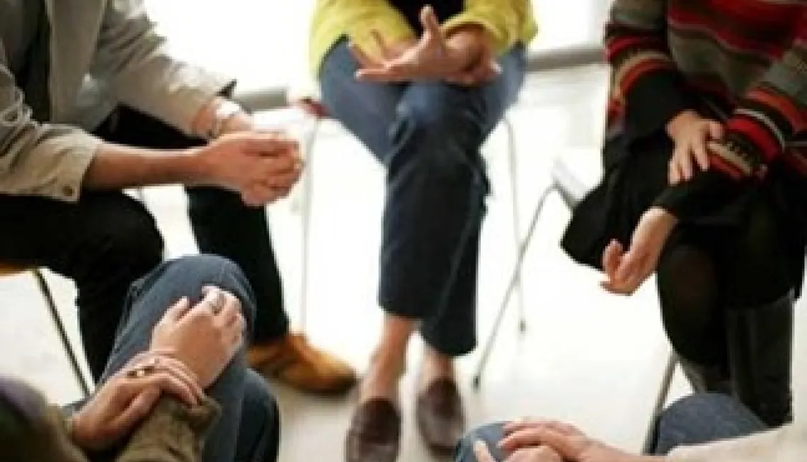 People sat together in a circle. 